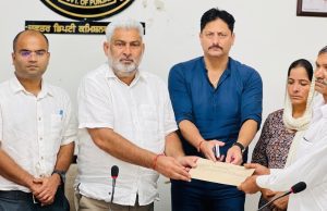 Cabinet Minister Lal Chand Kataruchak hands over cheques worth Rs. 4 lakh each to family members of four persons losing their lives in floods