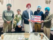 Speaker congratulates Gurpreet Singh Kamon for completing 150000 KM by cycling